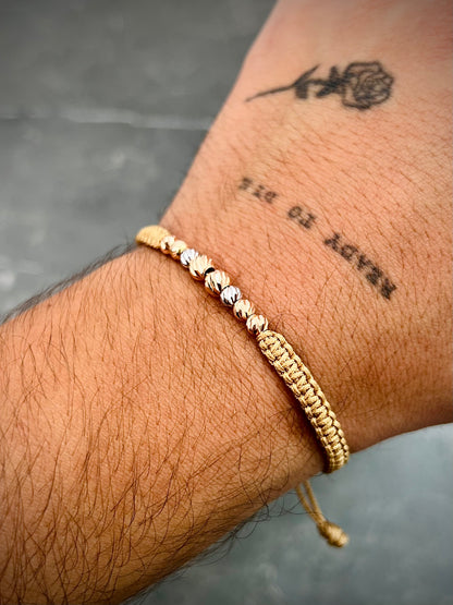 Pulsera en hilo beige con bolas diamantadas 0.75gr / Dos Oros (Joya) M