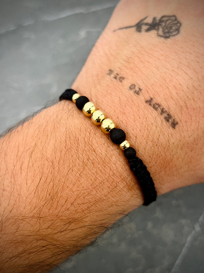 Pulsera hilo negro con bolas lisas. 0.75gr — Oro Amarillo