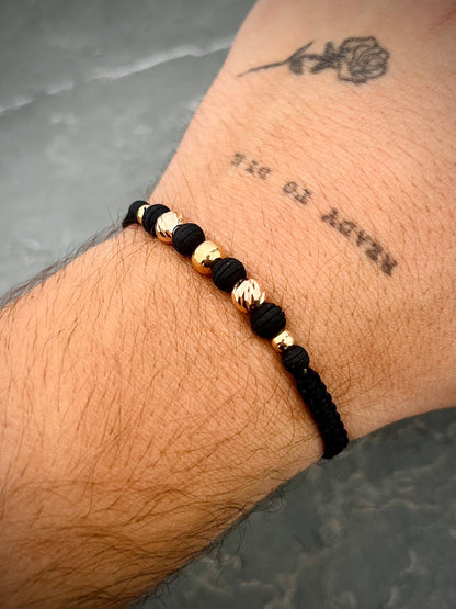 Pulsera en hilo negro con bolas diamantadas y lisas 0.75gr / Oro Rosado (Joya) M