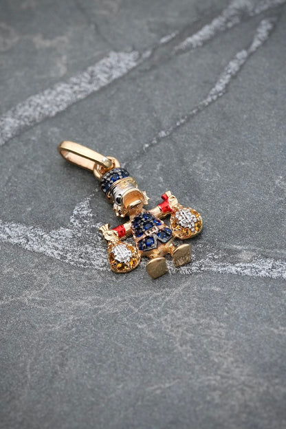 Dije tio rico con swarovski azul y amarillo 1.4gr / Largo 2.1cm — Oro Amarillo