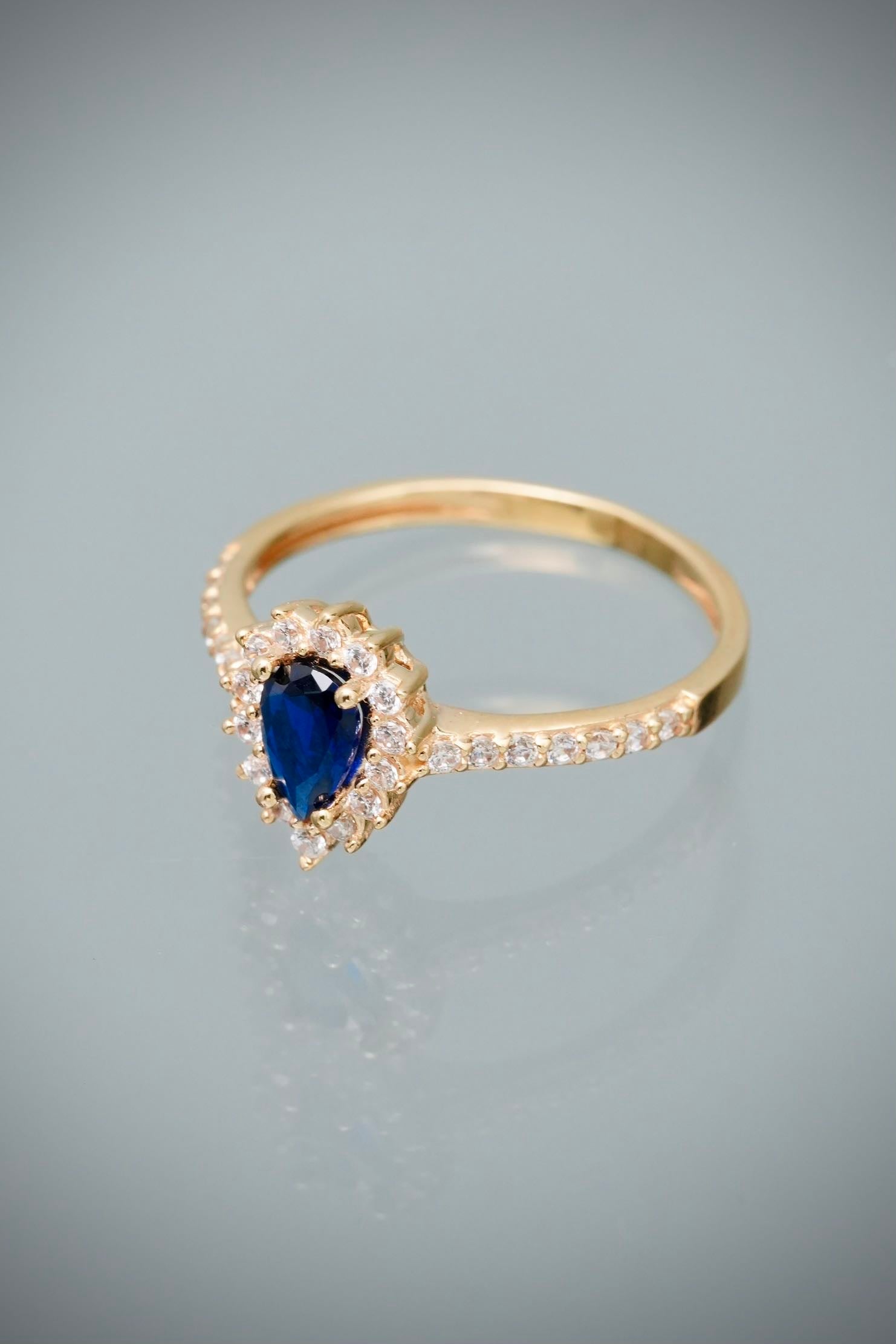 Solitario gota con swarovski azul y blanco 2.4gr / TALLA 6 1/2 / Oro Amarillo Nac M