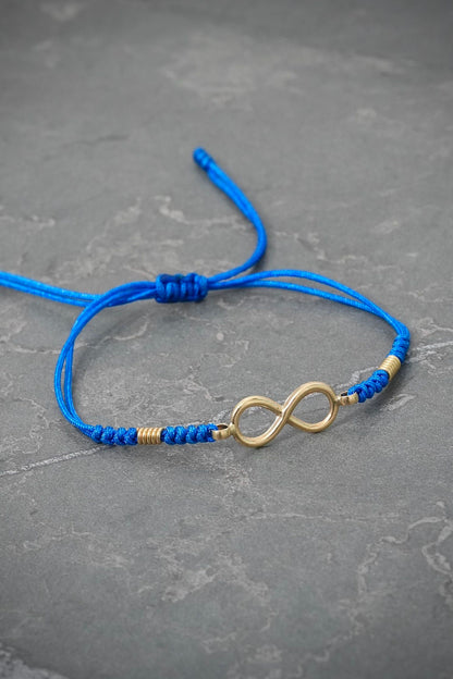Pulsera en hilo azul con herraje infinito 1gr / Oro Amarillo (Joya) M