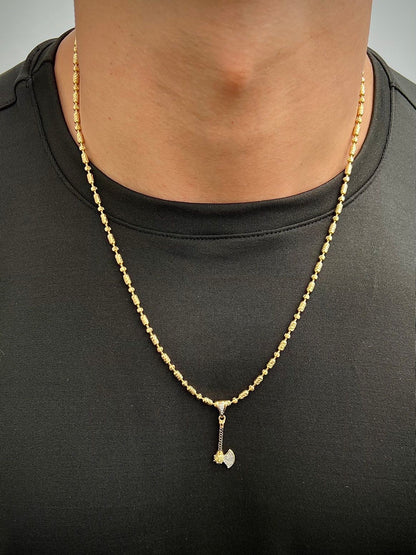Dije hacha con swarovski blanco y negro 2.1gr / Largo 3.5cm / Oro Amarillo Nac M