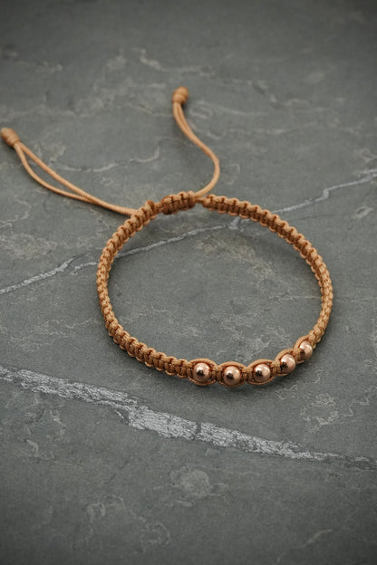 Pulsera en hilo beige con bolas lisas 0.4gr — Oro Rosado