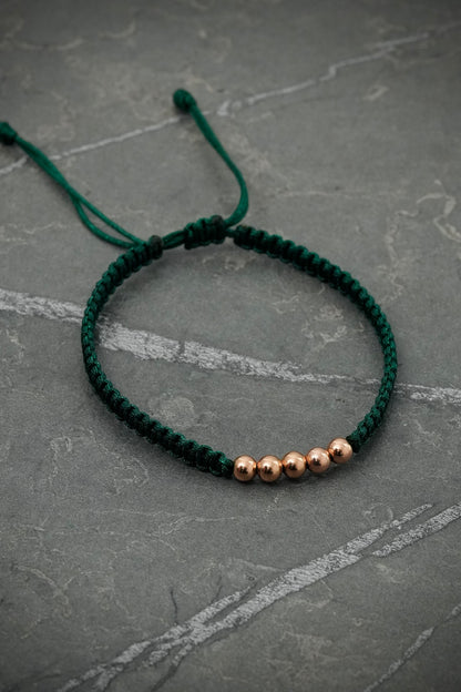 Pulsera en hilo verde con bolas lisas 0.4gr / Oro Rosado (Joya) M