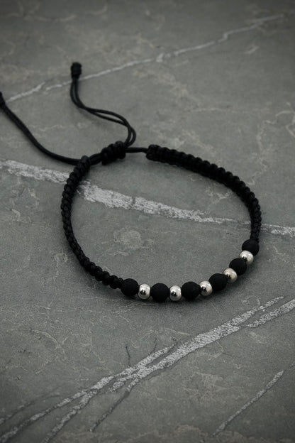 Pulsera en hilo negro con bolas lisas y neoprenos 0.4gr / Oro Blanco (Joya) M