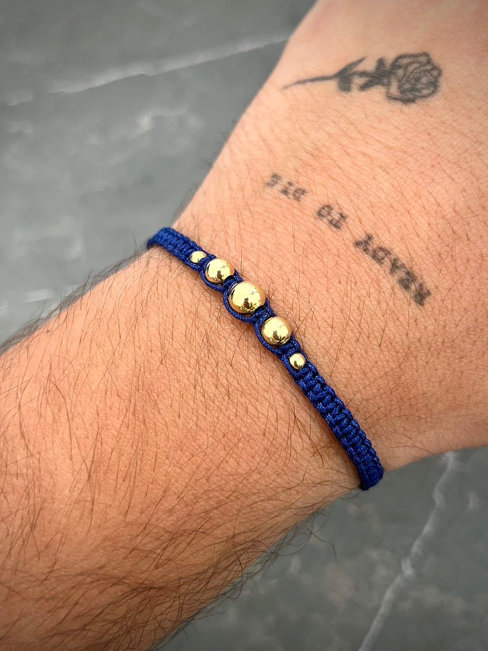Pulsera en hilo azul oscuro con bolas lisas 0.45gr / Oro Amarillo (Joya) M