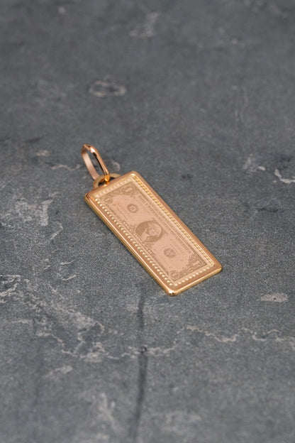 Dije dolar 1.05gr / Largo 2.9cm / Oro Rosado italy +4 M