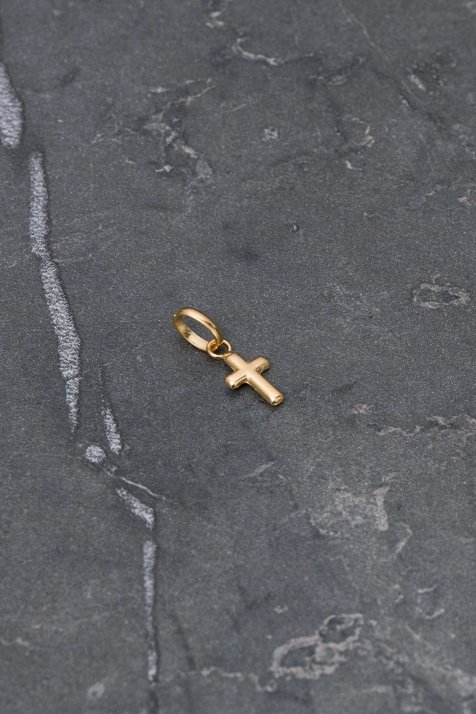 Dije cruz 0.2gr / Largo 1.4cm / Oro Amarillo Nac P