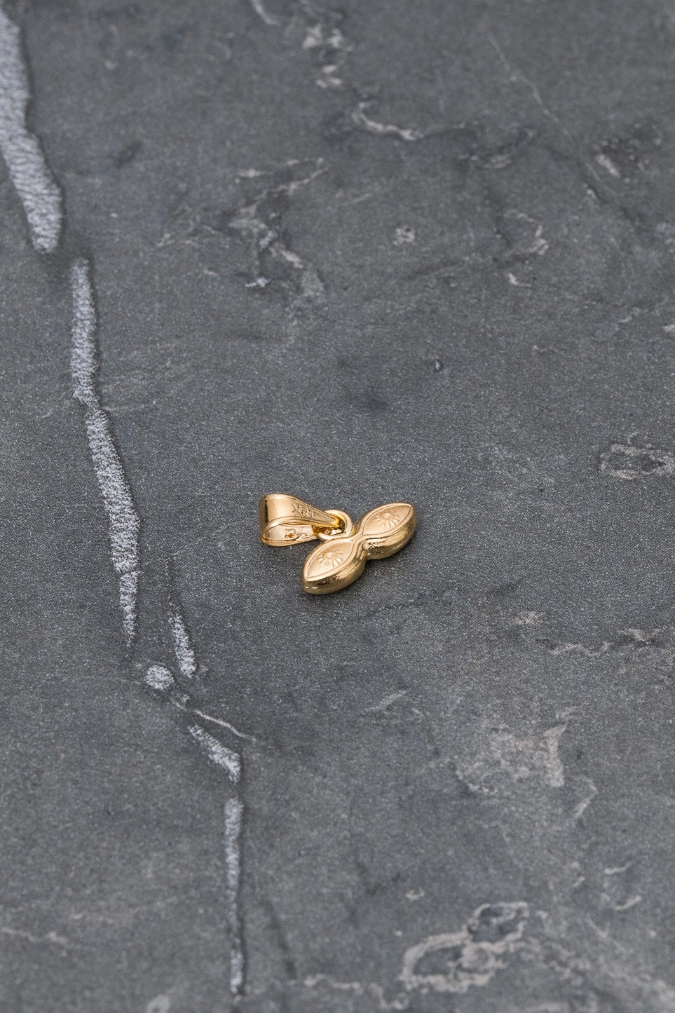 Dije ojos santa lucia 0.3gr / Largo 1.0cm / Oro Amarillo Nac P