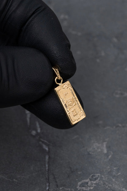 Dije de dolar 0.9gr / Largo 2.3cm — Oro Amarillo