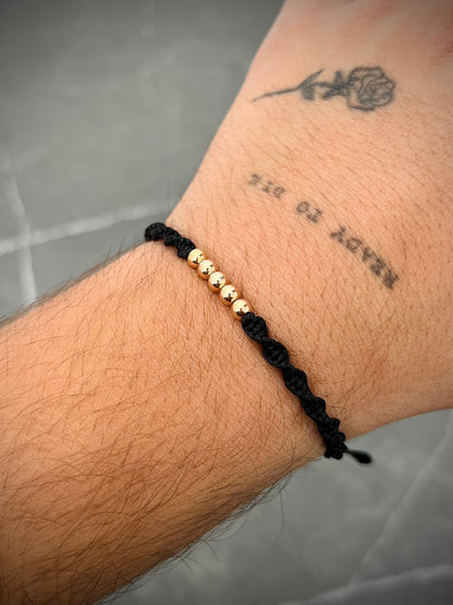 Pulsera en hilo negro con bolas lisas 0.4gr / Oro Rosado (Joya) M