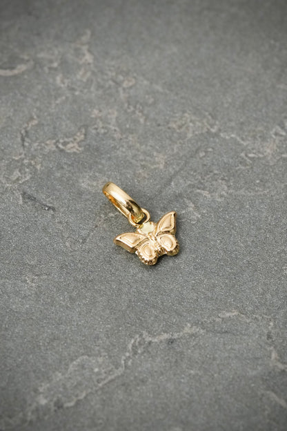 Dije mariposa 0.3gr / Largo 1.1cm — Oro Amarillo