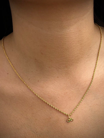 Dije infinito con swarovski verde 0.3gr / Largo 0.9cm / Oro Amarillo Nac B