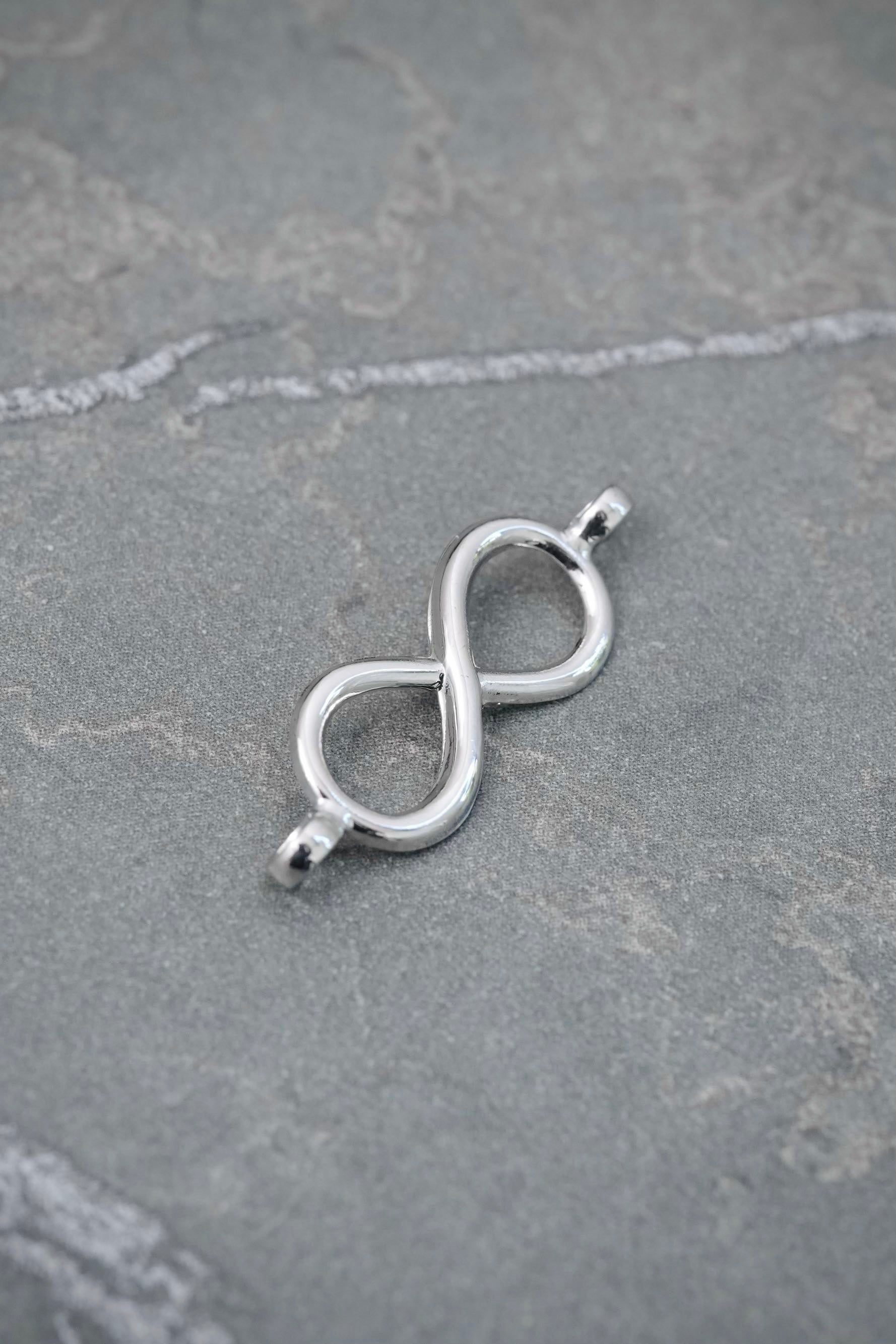 Herraje Infinito 0.4gr / 2.3cm / 7.9mm — Oro Blanco
