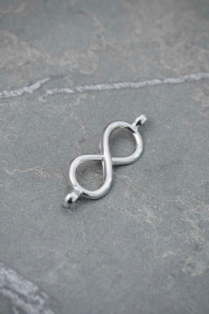 Herraje Infinito 0.4gr / 2.3cm / 7.9mm — Oro Blanco
