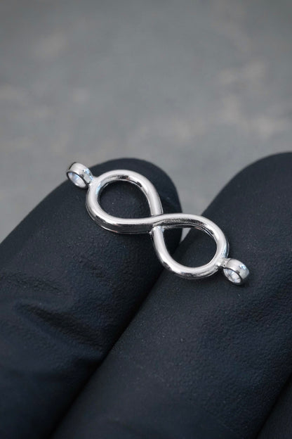Herraje Infinito 0.4gr / 2.3cm / 7.9mm — Oro Blanco