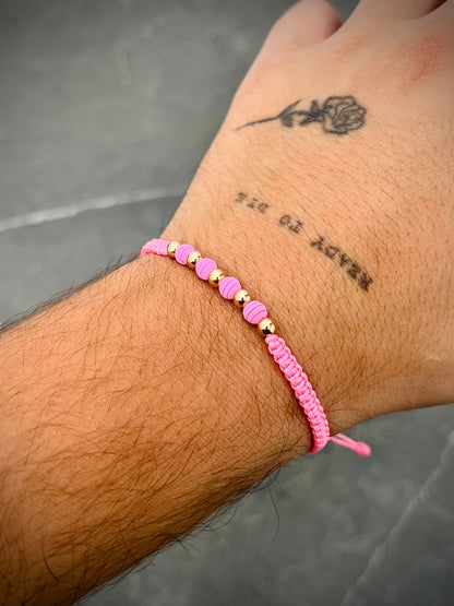 Pulsera en hilo rosado con bolas lisas y neoprenos 0.4gr / Oro Rosado (Joya) M