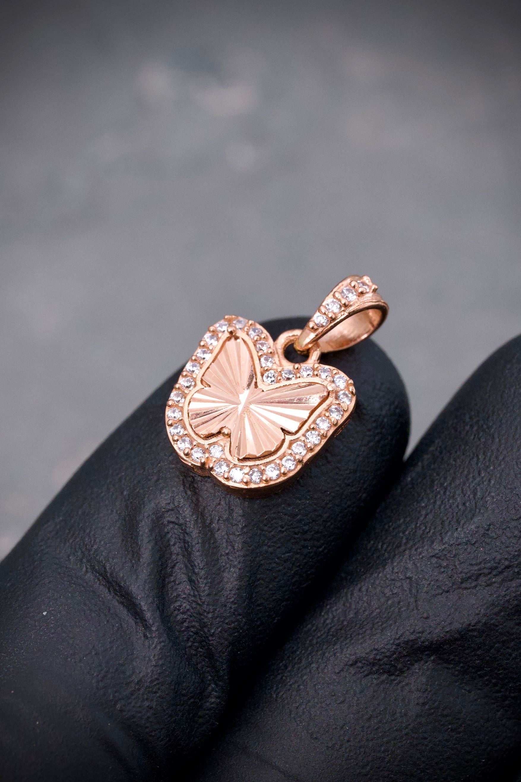 Dije mariposa con swarovski blanco 1.6gr / Largo 1.7cm / Oro Rosado Nac B