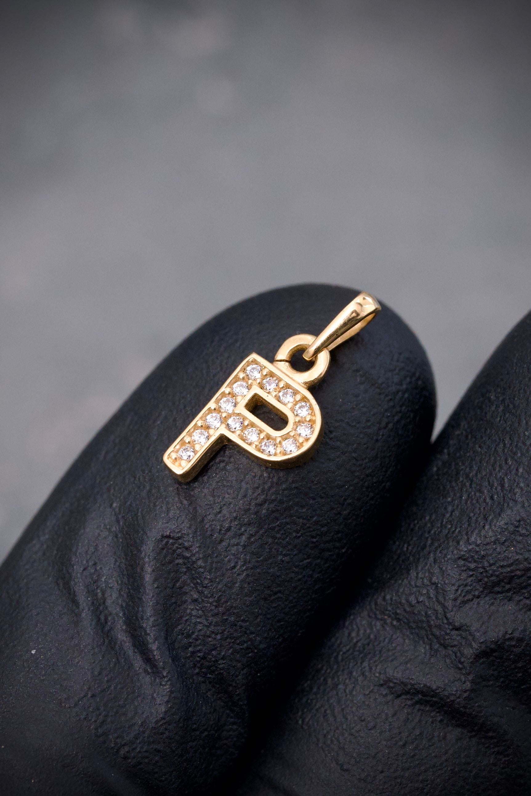 Dije letra p con swarovski blanco 0.7gr / Largo 1.5cm / Oro Amarillo Nac B