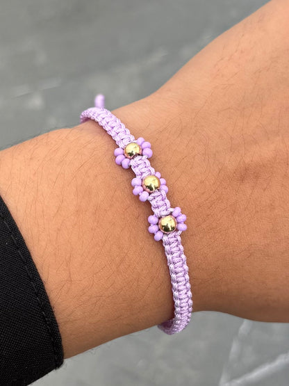 Pulsera en Hilo Morado de Flores 0.25gr — Oro Amarillo