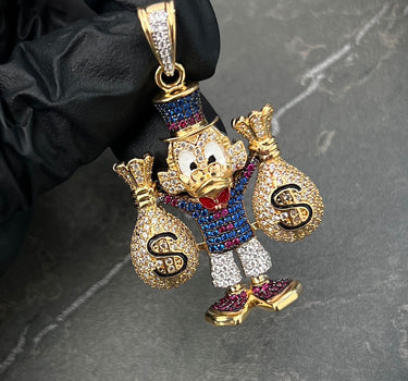 Dije tio rico son swarovski 15.1gr / Largo 4.8cm / Oro Amarillo Nac M