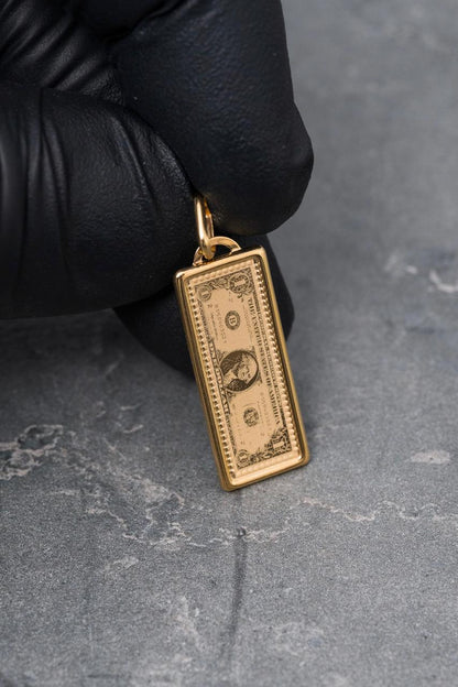 Dije dolar 1.1gr / Largo 3cm — Oro Amarillo