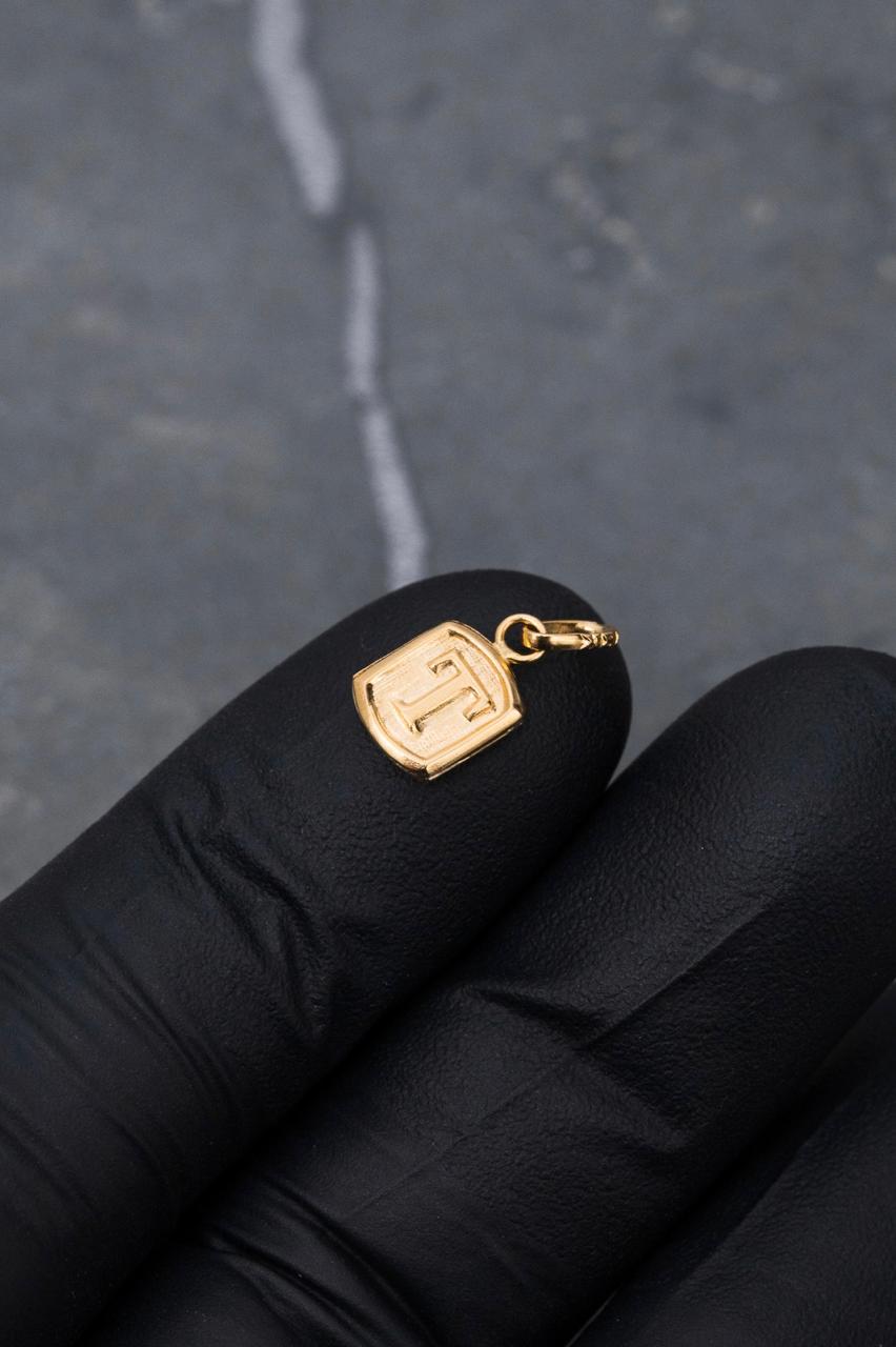 Dije letra t 0.4gr / Largo 1.5cm / Oro Amarillo Nac B