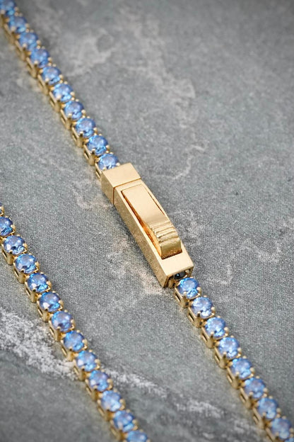 Pulso Tenis con Swarovski Azul 2.5gr / 18cm / 1.8mm — Oro Amarillo
