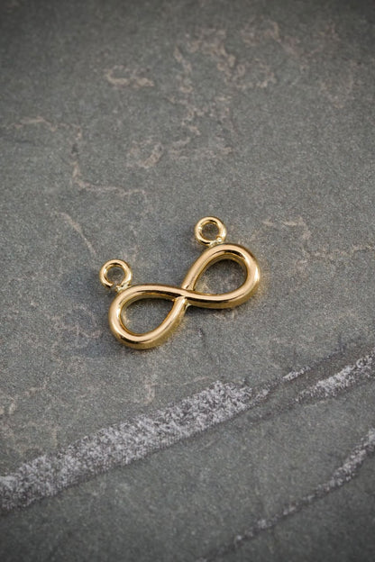 Herraje Infinito 0.45gr / 1.3cm / 9.3mm — Oro Amarillo