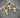 Dije de cruz relieve 0.35gr / 1.6cm / Oro Amarillo Nac B