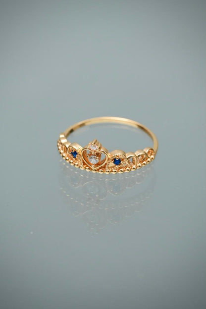 Anillo corona con swarovski azul y blanco 2.2gr / Talla 7 1/2 — Oro Amarillo