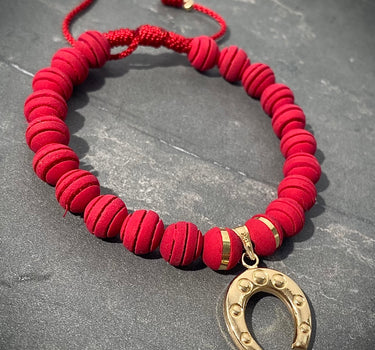 Pulsera en hilo rojo con dije de herradura 1.25gr / Oro Amarillo (Joya) M