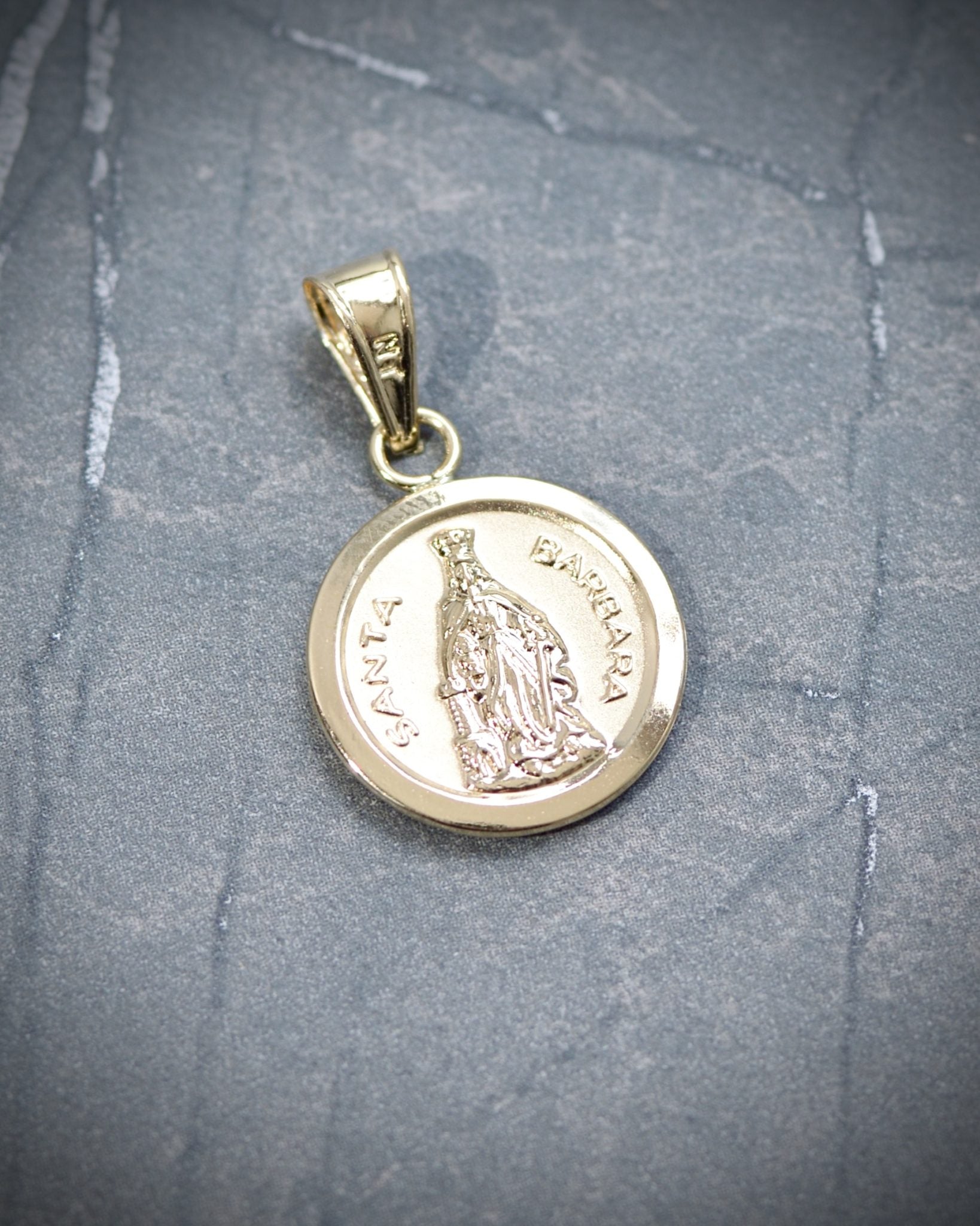Dije de santa barbara 1.3gr / 2.7cm / Oro Amarillo Nac M